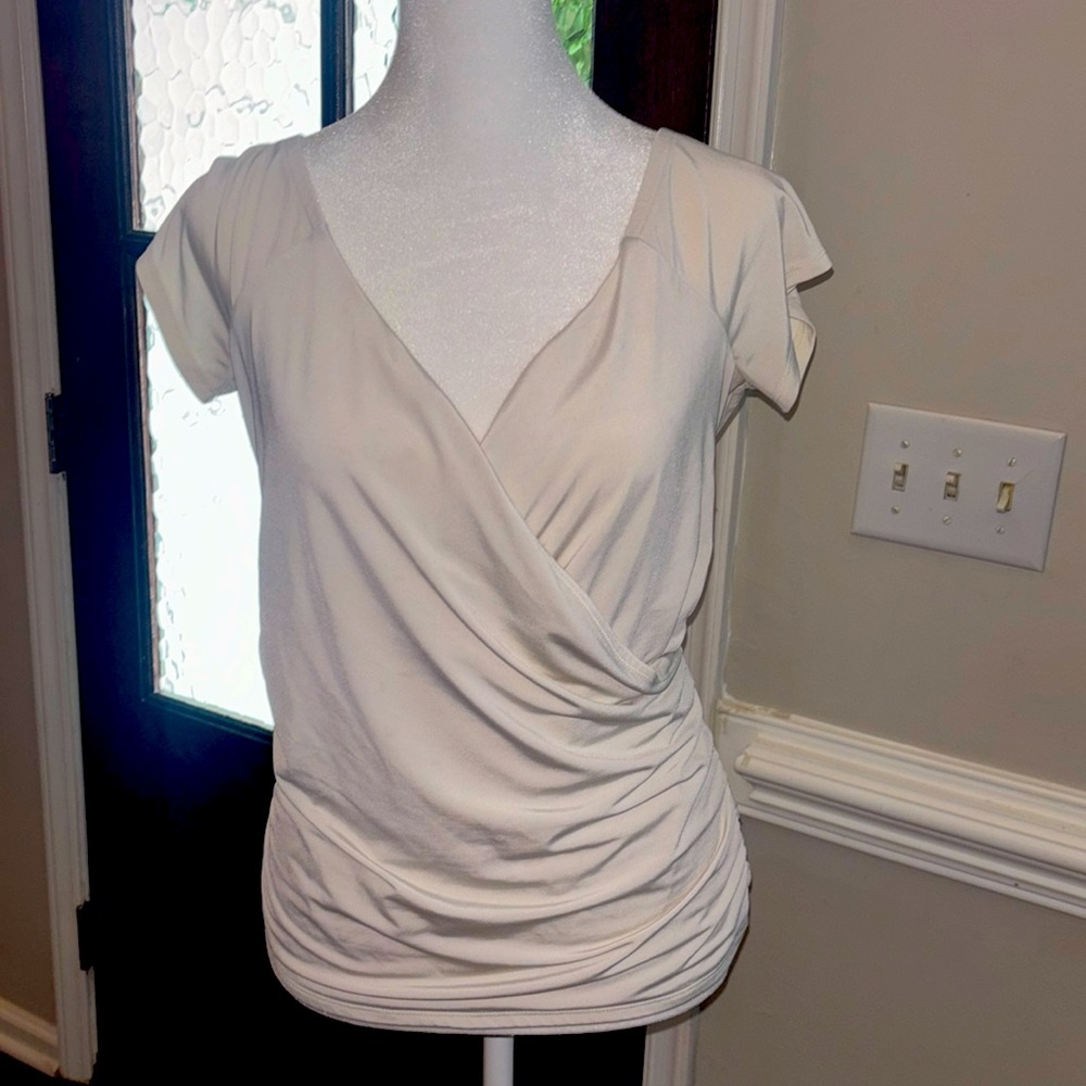 Ivory white faux wrap top.